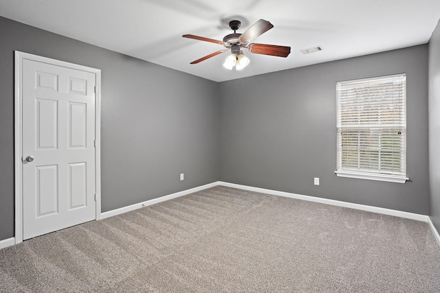 unfurnished room with carpet flooring and ceiling fan