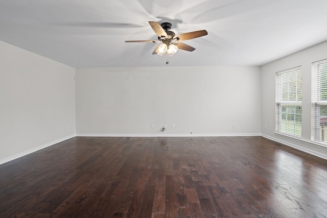 unfurnished room featuring dark hardwood / wood-style floors and ceiling fan