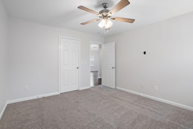 unfurnished bedroom with carpet flooring and ceiling fan