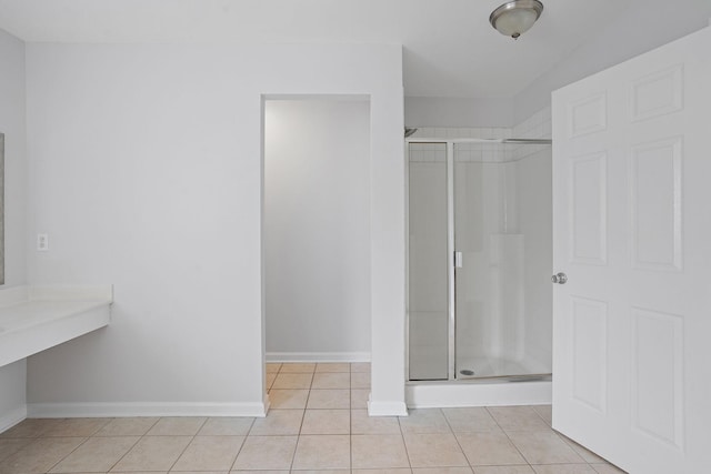 bathroom with tile patterned floors and an enclosed shower