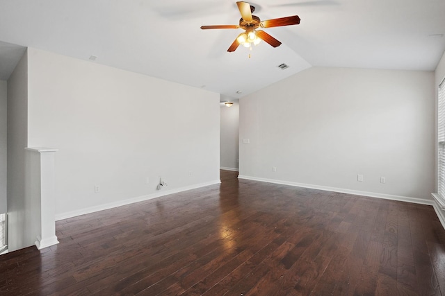 empty room with ceiling fan, dark wood-type flooring, and vaulted ceiling