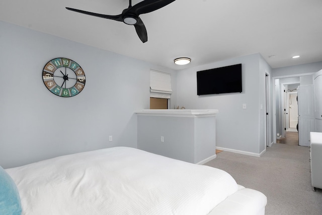 bedroom with light colored carpet and ceiling fan