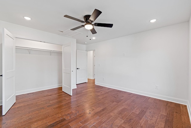 unfurnished bedroom with a closet, ceiling fan, and dark wood-type flooring