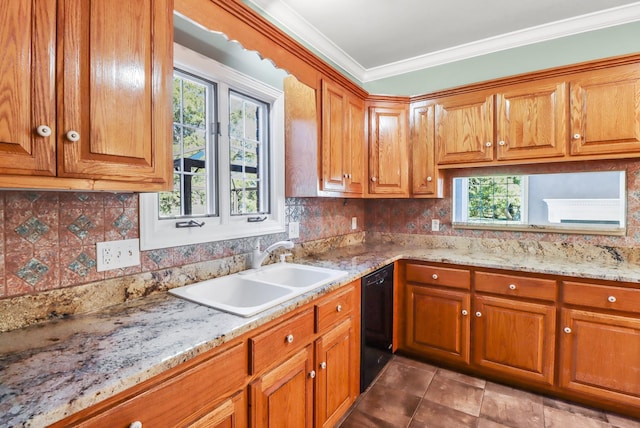 kitchen with black dishwasher, light stone countertops, sink, and a wealth of natural light