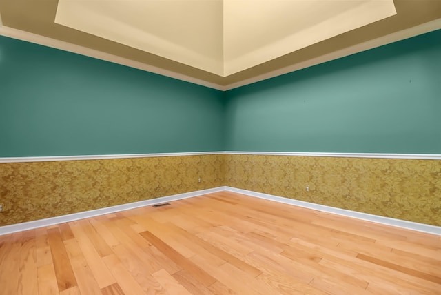 spare room with hardwood / wood-style flooring