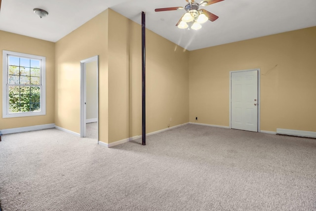 interior space with ceiling fan and light carpet