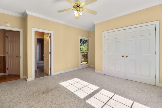 unfurnished bedroom featuring light carpet, a closet, ceiling fan, and ornamental molding