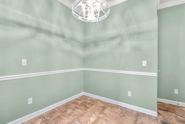 empty room featuring ornamental molding