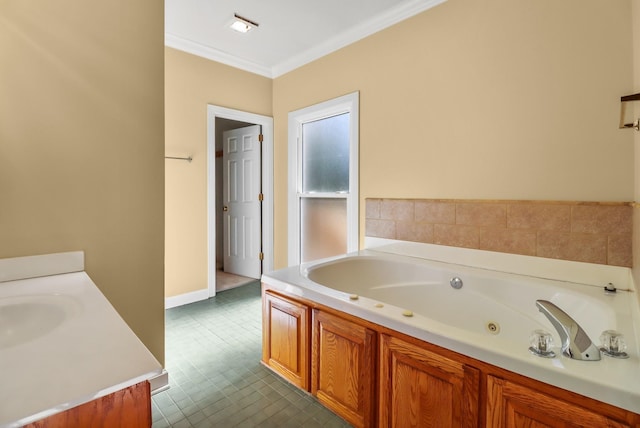 bathroom featuring tile patterned floors, a bathtub, crown molding, and vanity