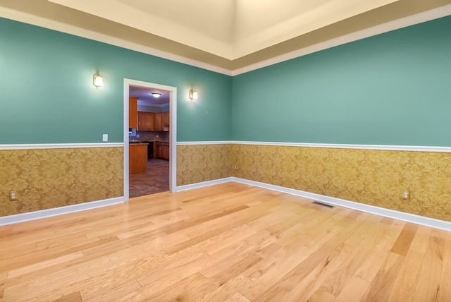 empty room with hardwood / wood-style flooring