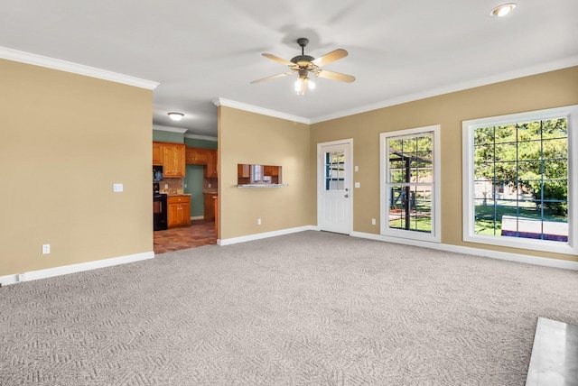 unfurnished living room with carpet floors, ceiling fan, and ornamental molding