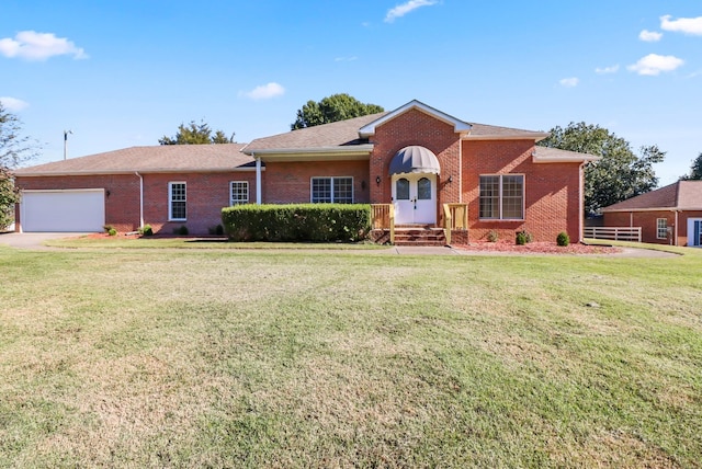 ranch-style home featuring a front yard