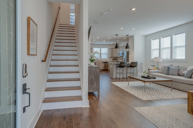 staircase featuring hardwood / wood-style flooring