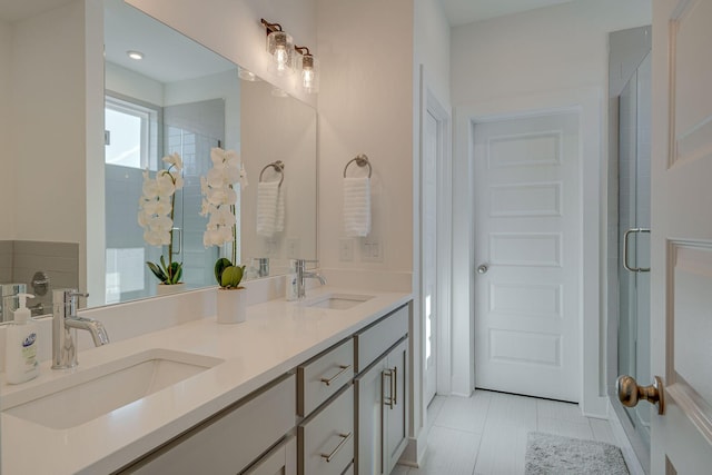 bathroom featuring vanity, tile patterned floors, and an enclosed shower