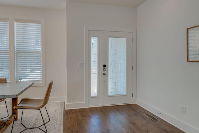 foyer with dark hardwood / wood-style flooring