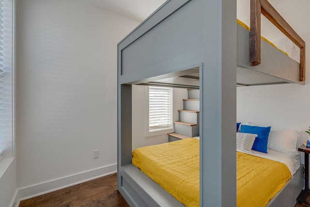 bedroom featuring dark hardwood / wood-style flooring