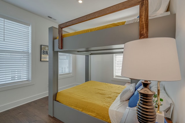 bedroom featuring dark hardwood / wood-style flooring