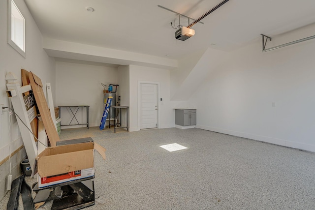 garage with a garage door opener and water heater