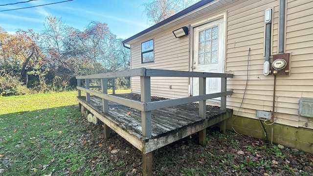 wooden deck with a yard