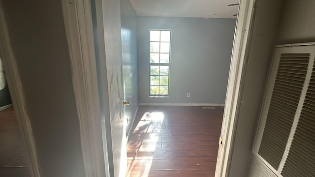 hall with dark hardwood / wood-style flooring