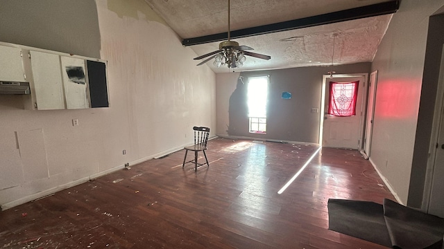 spare room featuring beamed ceiling, hardwood / wood-style floors, and ceiling fan