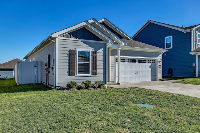 view of front of house featuring a garage and a front lawn