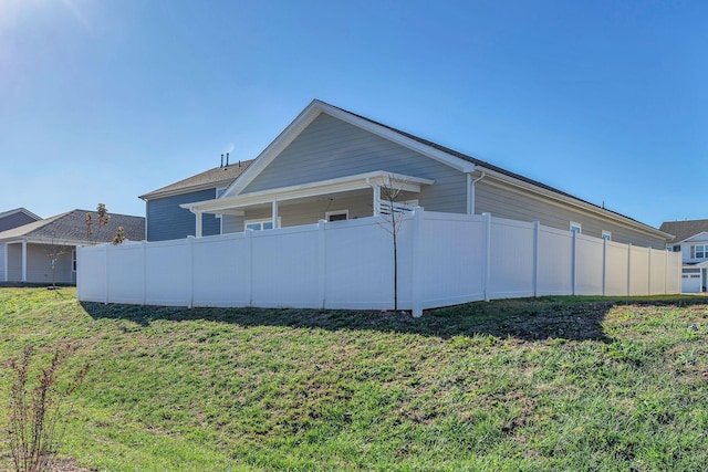 view of property exterior featuring a yard