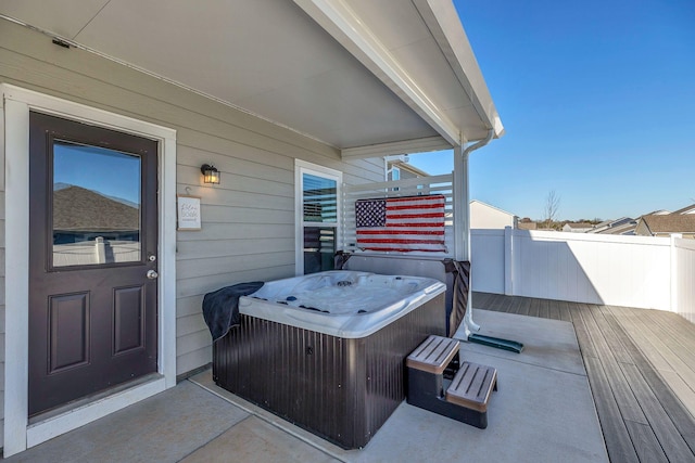 view of patio featuring a hot tub and a wooden deck