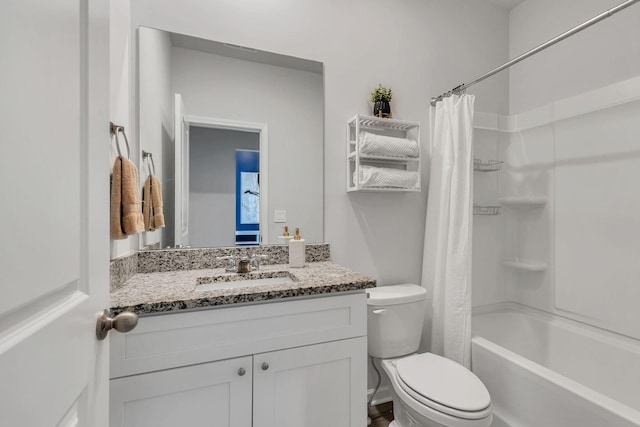 full bathroom featuring vanity, shower / bath combination with curtain, and toilet