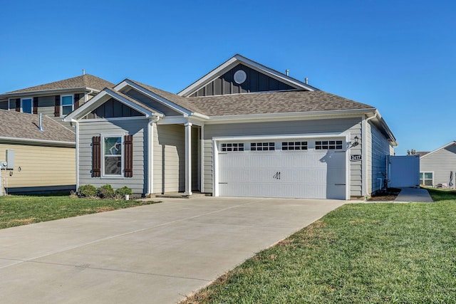 craftsman inspired home featuring a front lawn and a garage