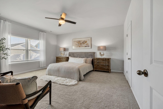 bedroom featuring ceiling fan and light colored carpet