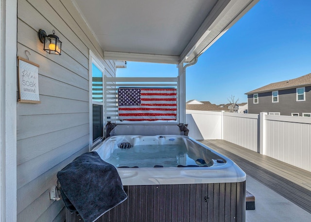 view of patio / terrace with a hot tub