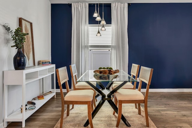 dining space featuring dark hardwood / wood-style flooring