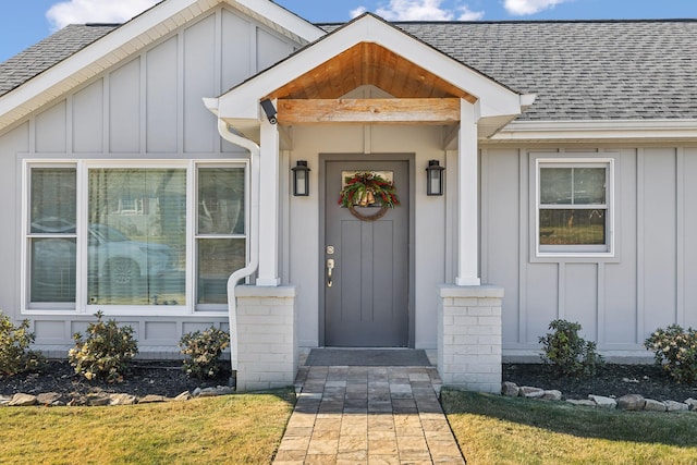 doorway to property featuring a yard