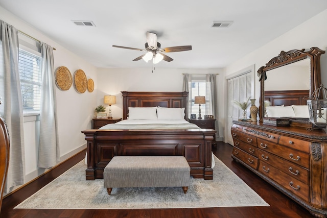 bedroom featuring a closet, ceiling fan, and dark hardwood / wood-style flooring