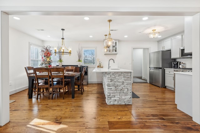 kitchen with white cabinetry, sink, dark wood-type flooring, and appliances with stainless steel finishes