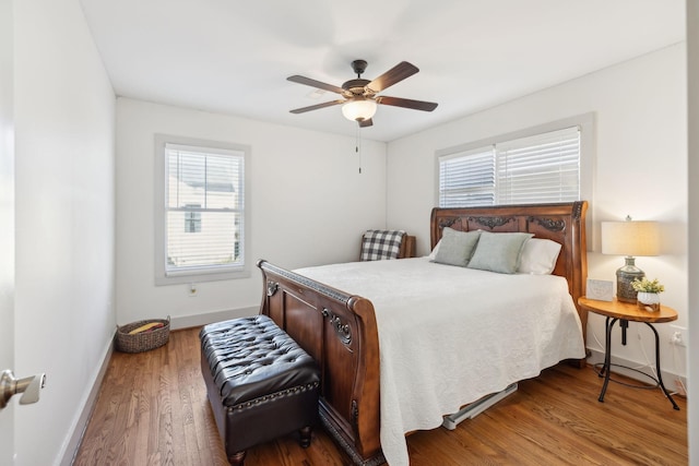 bedroom with ceiling fan and hardwood / wood-style flooring