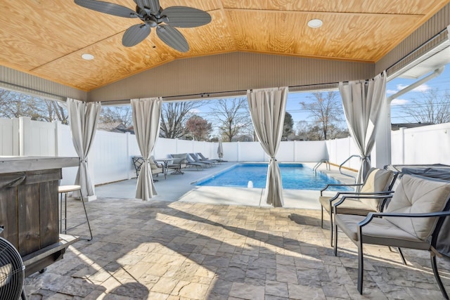 view of swimming pool with a patio area and ceiling fan