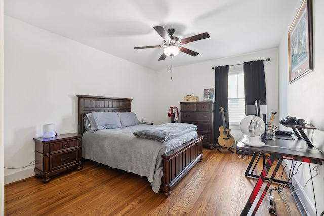 bedroom featuring hardwood / wood-style floors and ceiling fan