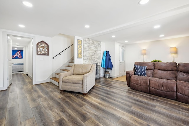 living room featuring dark wood-type flooring