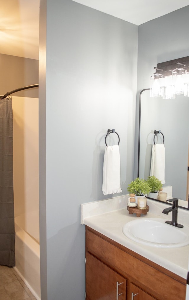 bathroom with tile patterned flooring, vanity, and shower / bathtub combination with curtain