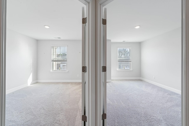 interior space featuring light carpet