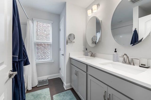 bathroom with vanity and hardwood / wood-style flooring