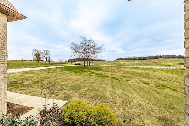 view of yard with a rural view