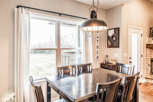 dining room featuring hardwood / wood-style flooring and a wealth of natural light