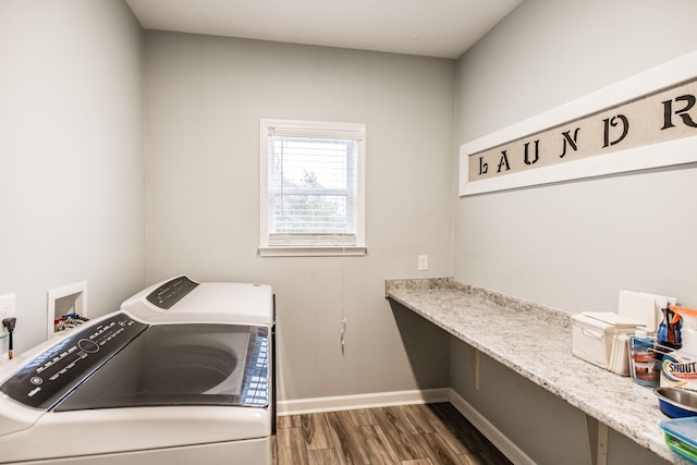 washroom with dark hardwood / wood-style floors and washing machine and clothes dryer