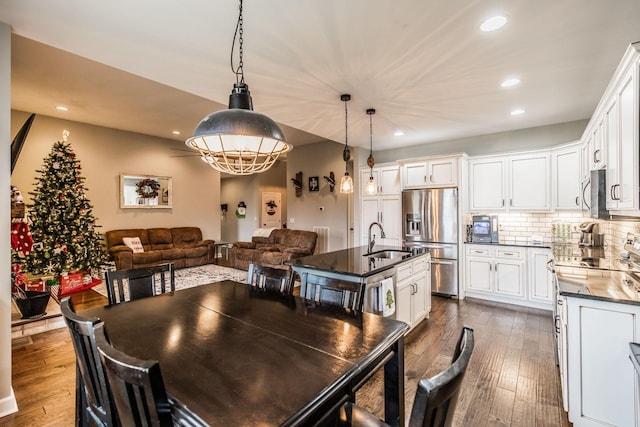 dining area featuring dark hardwood / wood-style floors and sink