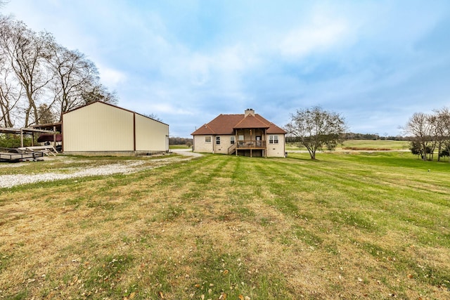 view of yard with a deck and a rural view