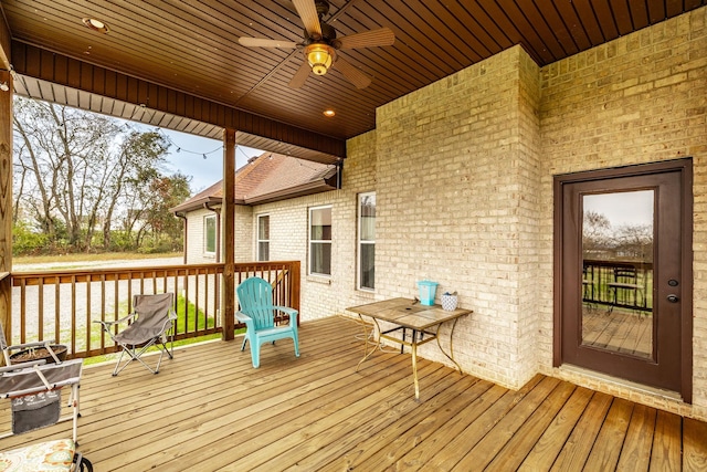 wooden terrace featuring ceiling fan