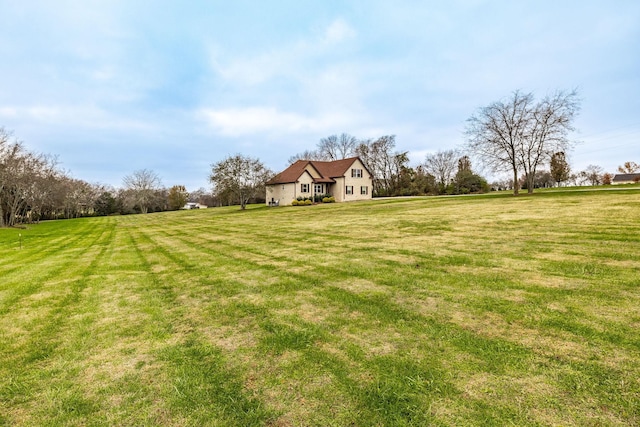 view of yard with a rural view